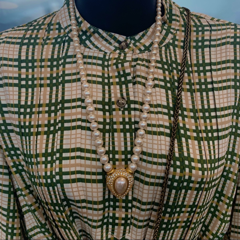 Yellow and green, long sleeve, pleated dress.